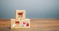 Wooden blocks with online shopping symbols. Shopping cart, card for payment, delivery truck. Seller over the Internet. Ecommerce Royalty Free Stock Photo