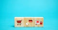 Wooden blocks with online shopping symbols. Shopping cart, card for payment, delivery truck. Seller over the Internet. Ecommerce