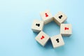 wooden blocks with people icon over blue background, building a strong team, human resources and management concept Royalty Free Stock Photo