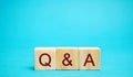 Wooden blocks Q&A question and answer concept. Communication, brainstorming, business. Search for information. Ask for an