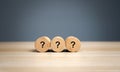 Wooden blocks with a question mark. Asking questions, searching for truth. Riddle mystery, investigation and research. FAQ -