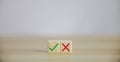 Wooden blocks show right and wrong signals, concepts, decisions, votes, and think yes or no. Business options for difficult