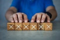 Wooden blocks show the wrong marks. concepts decisions, votes, and thinking no