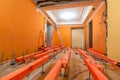 Wooden blocks on the studs for lifting up floor due installing plumbing and canalization and ladder under floor i Royalty Free Stock Photo