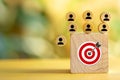 Wooden blocks with target icon represent customer focus in crm concept