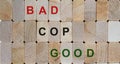 Wooden  blocks with text `bad cop, good cop`. Beautiful wooden background. Copy space Royalty Free Stock Photo