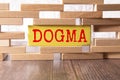 Wooden blocks with the text: dogma. Dogma word made with building blocks, business concept Royalty Free Stock Photo