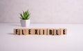 Wooden Blocks with the text: Flexible. Adapt to the new normal concept. Business and lifestyle concept