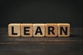 Wooden Blocks with the text LEARN in dark background Royalty Free Stock Photo