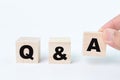 Wooden blocks with text Q&A over white background Royalty Free Stock Photo