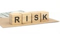 wooden blocks with the text: Risk, gray background