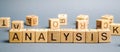 Wooden blocks with the word Analysis. Analytical research. Forecasting processes and business optimization. SWOT, PEST analysis