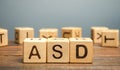 Wooden blocks with the word ASD - Autism Spectrum Disorder. Neurological and developmental disorder