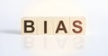 Wooden blocks with the word Bias. Preconception