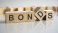 Wooden blocks with the word Bonds. Equivalent loan. Unsecured and secured bonds Royalty Free Stock Photo