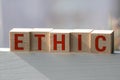 Wooden blocks with the word Ethic. Defending, systematizing and recommending concepts of right and wrong conduct. Moral philosophy Royalty Free Stock Photo