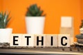 Wooden blocks with the word Ethic. Defending, systematizing and recommending concepts of right and wrong conduct. Moral philosophy Royalty Free Stock Photo