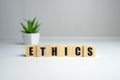 Wooden blocks with the word Ethic. Defending, systematizing and recommending concepts of right and wrong conduct. Moral philosophy Royalty Free Stock Photo