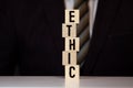 Wooden blocks with the word Ethic. Defending, systematizing and recommending concepts of right and wrong conduct. Royalty Free Stock Photo