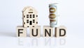 Wooden blocks with the word For FUND Real estate concept. Rent apartment