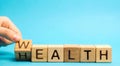 Wooden blocks with the word Health and Wealth. Concept of choosing priority in life and lifestyle. Make the right choice. Life Royalty Free Stock Photo