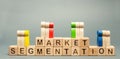 Wooden blocks with the word Market Segmentation and multicolored groups of people. Target audience, customer care. Market group of Royalty Free Stock Photo