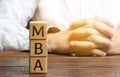 Wooden blocks with the word MBA - Master of Business Administration. Degree of professionalism in business management. Accounting