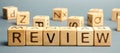 Wooden blocks with the word Review. Customer review concept. Reviewing, auditing, reviewer. Service rating. Feedback