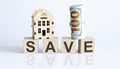 Wooden blocks with the word For SAVE Real estate concept. Rent apartment. Property