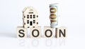 Wooden blocks with the word For SOON Real estate concept. Rent apartment