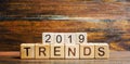 Wooden blocks with the word Trends 2019. Main trend of changing something. Popular and relevant topics. New ideological trends of Royalty Free Stock Photo