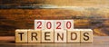 Wooden blocks with the word Trends 2020. Main trend of changing something. Popular and relevant topics. New ideological trends of Royalty Free Stock Photo