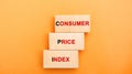 Wooden blocks with the words Consumer price index. Measuring the average level of change in prices for goods and services. Royalty Free Stock Photo