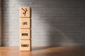 Wooden blocks with the words FAMILY, WORK and LIFE - 3D rendered illustration