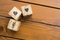 Wooden blocks with the words lie on the table. Wooden cubes with letters and symbols.