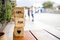 Wooden blocks with the words lie on the table. Wooden cubes with letters and symbols. Life for love.