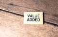 Wooden blocks with words 'Value added