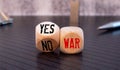 Wooden blocks with the words War, yes and no. Conflict between political states and factions Royalty Free Stock Photo