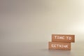 Wooden blocks written with text TIME TO RETHINK