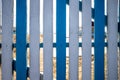 Wooden blue and white fence with  beach background Royalty Free Stock Photo