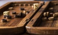 Wooden Board with backgammon, pawns, dice, close up