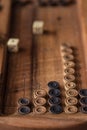 Wooden Board with backgammon, pawns, dice, close up