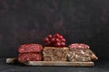 Wooden board with boiled pork meat roll, beef tongue roll and homemade sausage Royalty Free Stock Photo