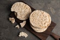 Wooden board with crunchy rice cakes Royalty Free Stock Photo