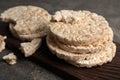 Wooden board with crunchy rice cakes Royalty Free Stock Photo