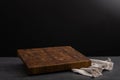 Wooden board for cutting on a black background. Royalty Free Stock Photo