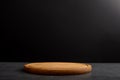 Wooden board for cutting on a black background. Royalty Free Stock Photo