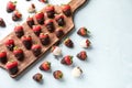 Wooden board with delicious strawberries covered with chocolate on color background Royalty Free Stock Photo