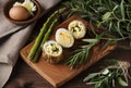 a wooden board with an egg and asparagus rolls in it Royalty Free Stock Photo