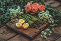 a wooden board with an egg and asparagus rolls in it Royalty Free Stock Photo